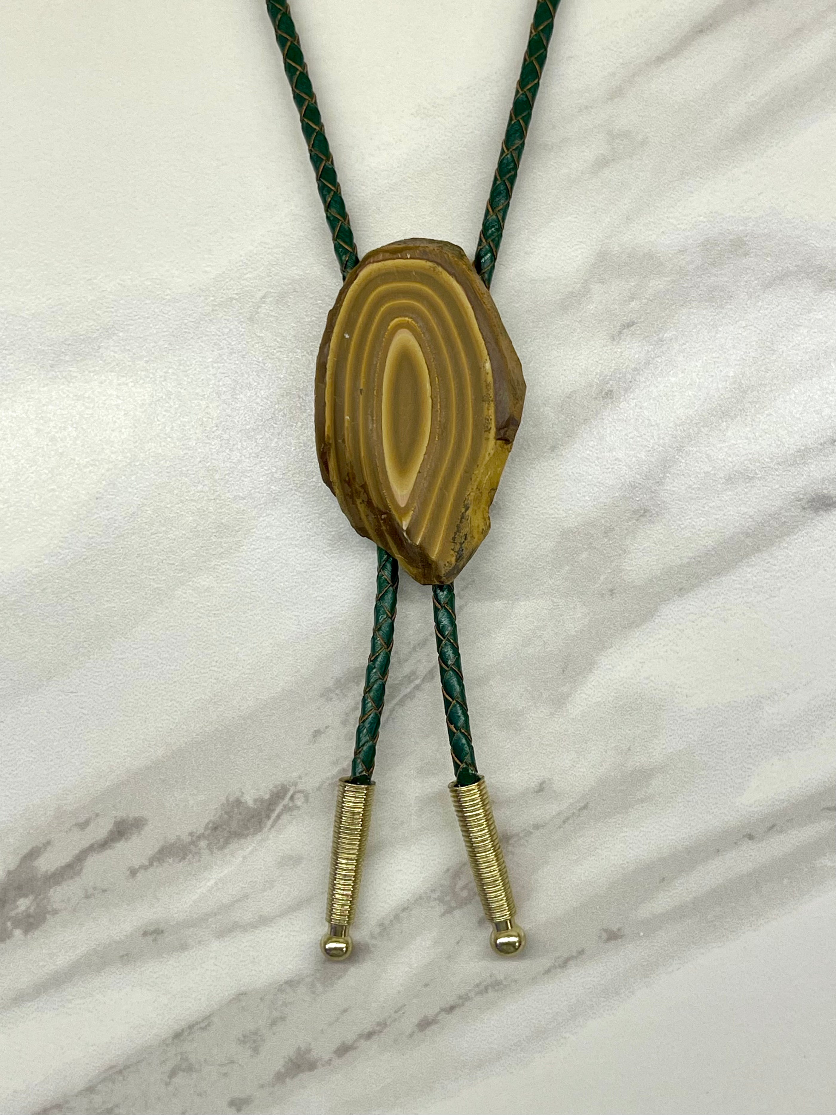A stromatolite bolo tie by Cord & Clasp