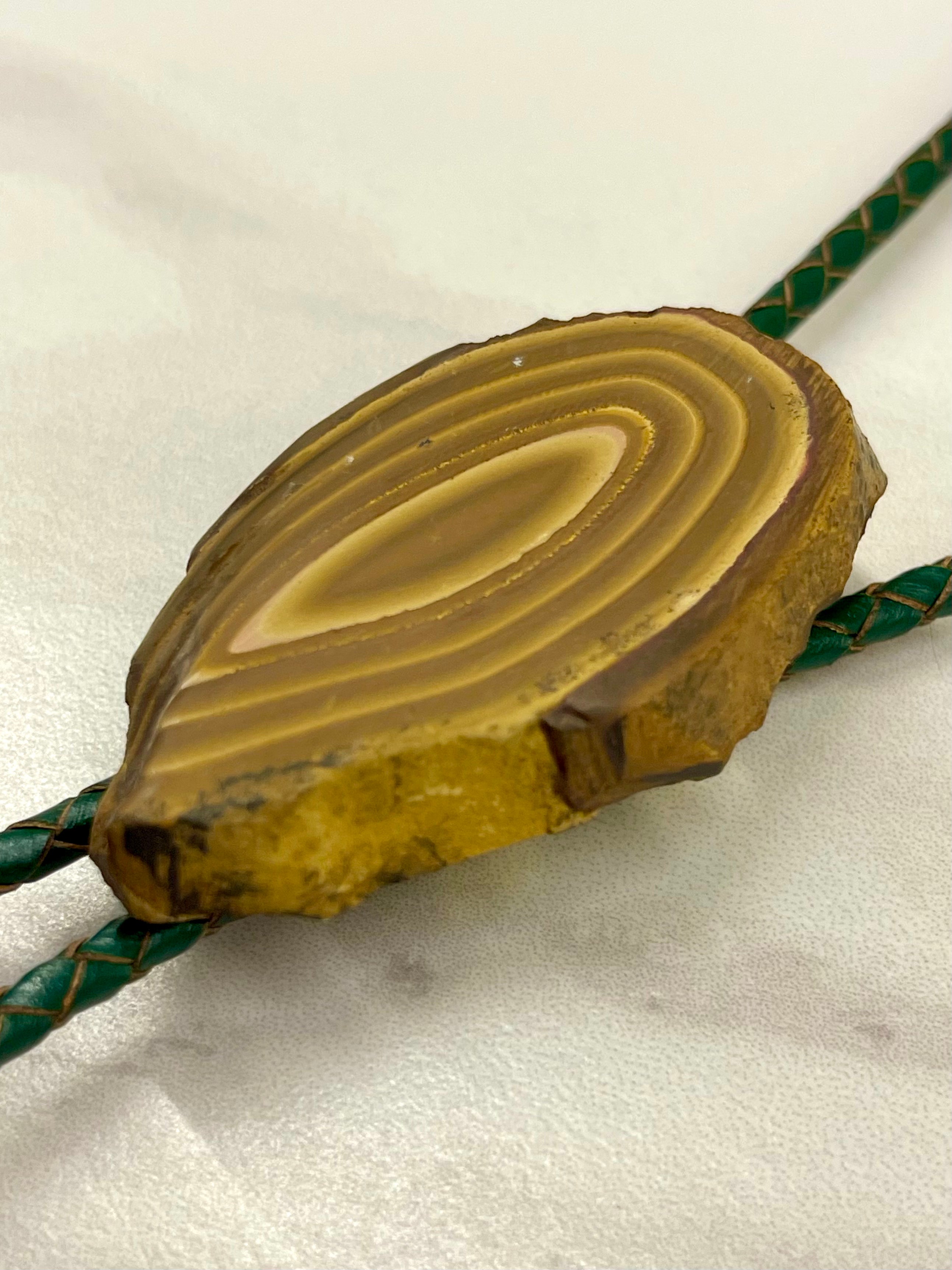 A stromatolite bolo tie by Cord & Clasp