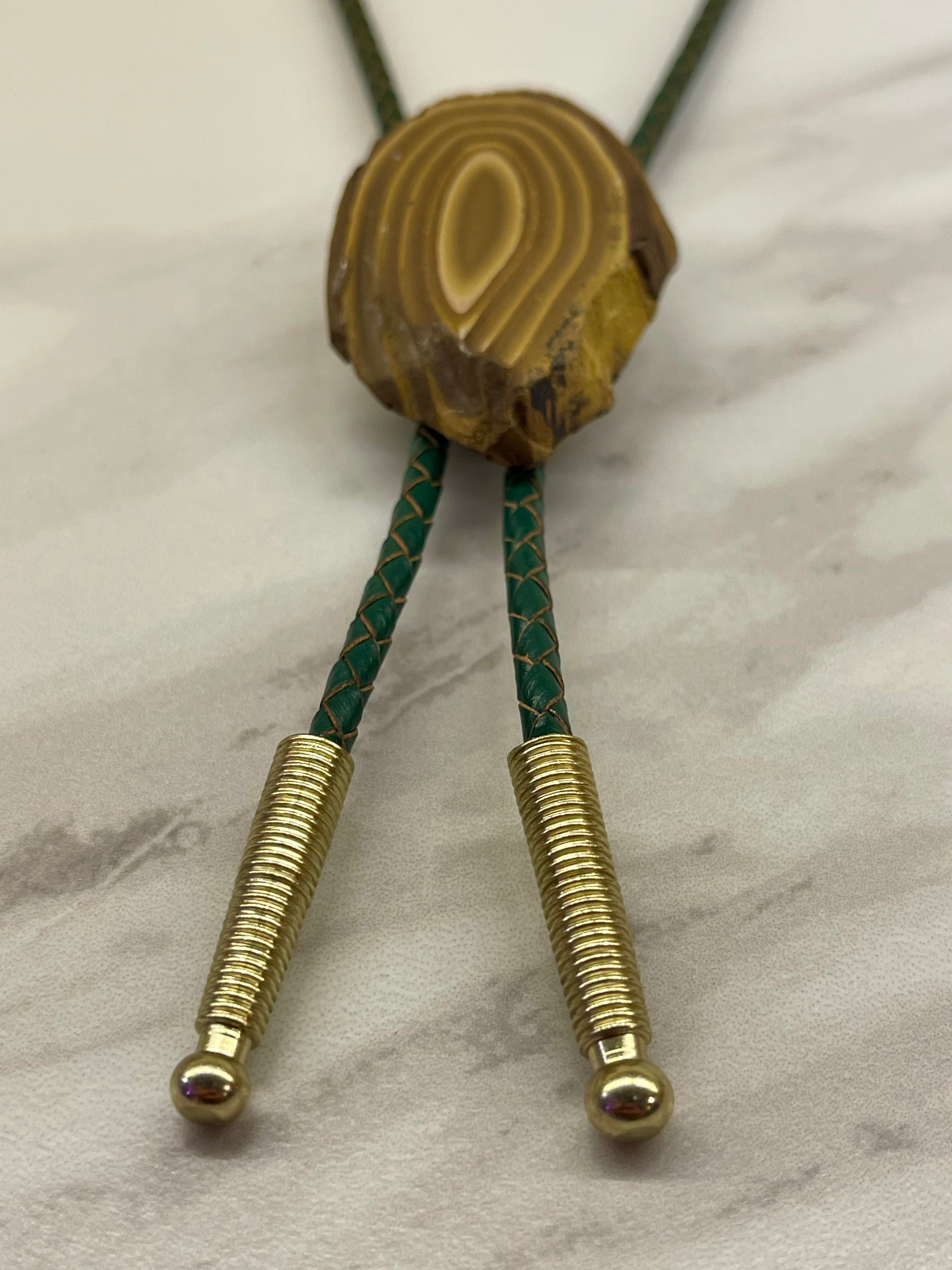 A stromatolite bolo tie by Cord & Clasp