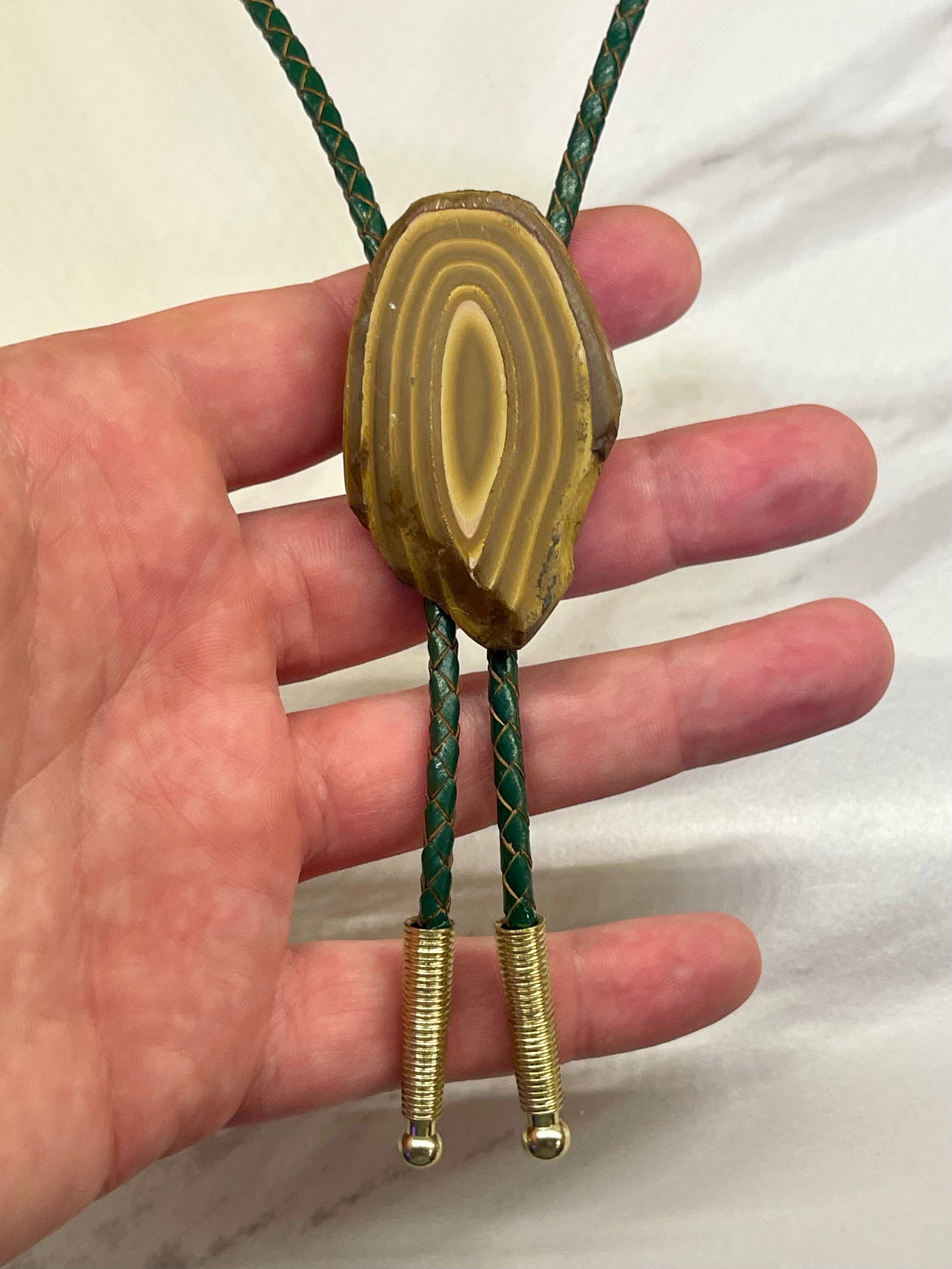 A stromatolite bolo tie by Cord & Clasp
